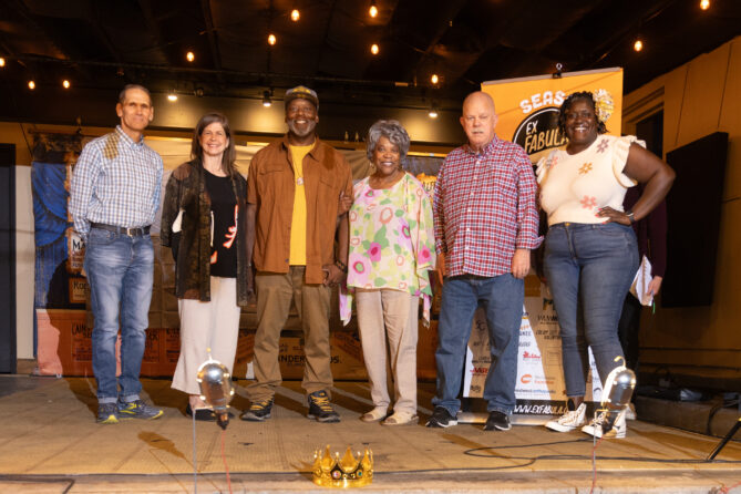ALLSTARS storytellers standing on stage at the Anodyne coffee shop.